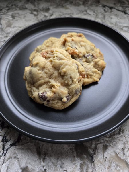 A black plate with 3 Kitchen Sink Cookies